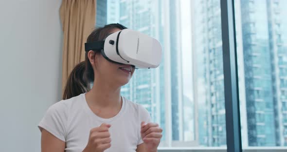 Woman Play Boxing Game and Wearing VR Device