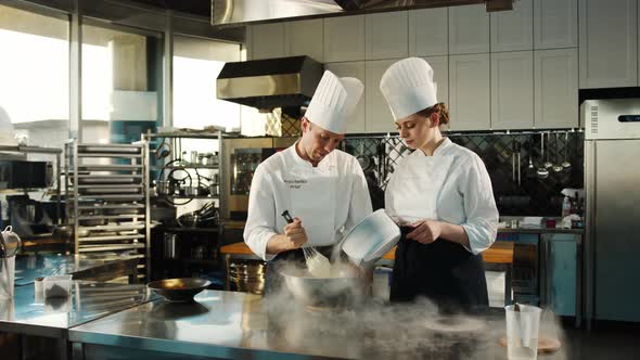 Professional kitchen: liquid nitrogen is added during the cooking of a molecular dish