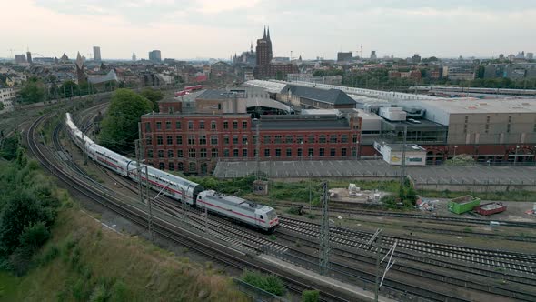 Aerial View of an double-decker Inter-City 2 train entering the rail yard in Cologne, Germany