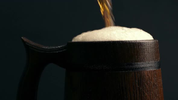 Beer Poured And Froths Over Side Of Tankard