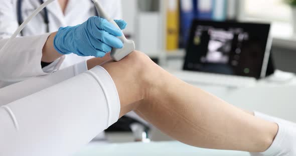 Doctor Uses Sonography to Take Sports Xray of Patient Knee