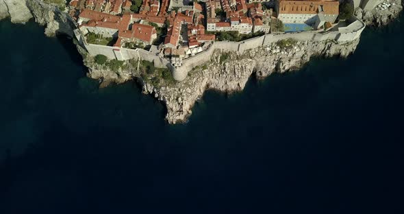 Aerial birds eye view of Dubrovnik Old Town. the camera slowly approaches the city from the sea, sho