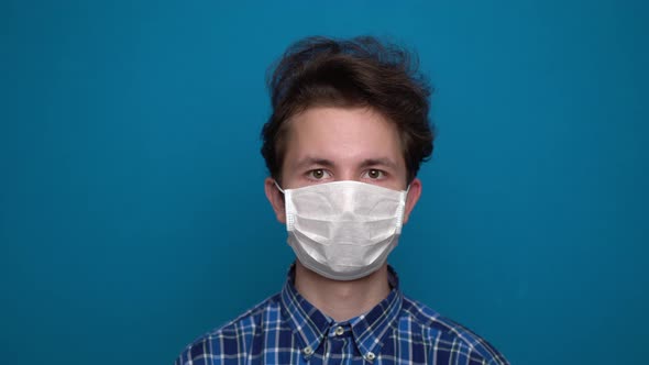 Boy Feeling Sick and Wearing Mask