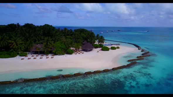Aerial drone view scenery of beautiful seashore beach lifestyle by aqua blue water and white sand ba
