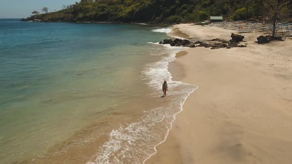 Girl Walking on the Beach