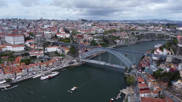 Aerial panorama shot of Dom Luís I Bridge –  double-deck metal arch bridge that spans the River Dour