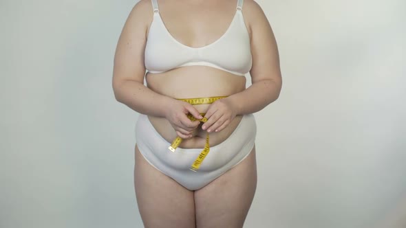 Fatty Female Taking Body Measurements, Dieting and Motivation, Weight Loss