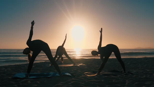 Group Of Women Practicing Yoga