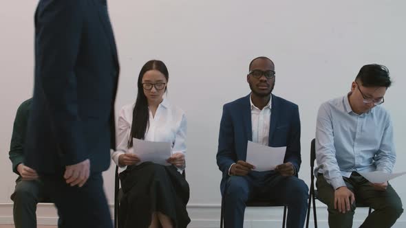 Impatient Diverse People Waiting for Interview