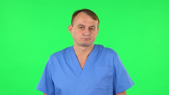 Upset Man Disappointed Looks at Camera and Shrugs. Green Screen