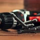 Bits Fall on the Table Next to the Screwdriver - VideoHive Item for Sale