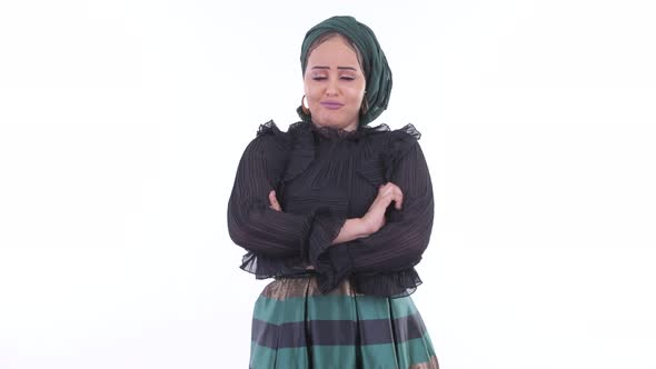 Stressed Young African Muslim Woman Looking Angry with Arms Crossed