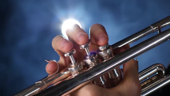 The Smoky Studio with Lighting Playing Trumpet