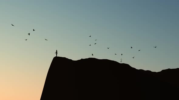 Silhouette Of Woman Doing Sports At The Peak alt