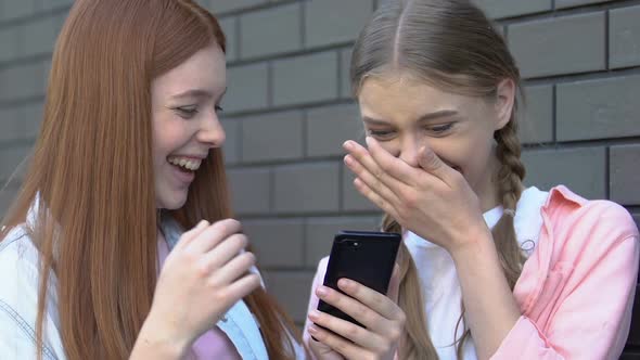 Girls Laughing at Shameful Post With Classmate in Social Media Cyberbullying