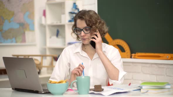 Young Serious Female Student Studying in School. World Teachers Day.