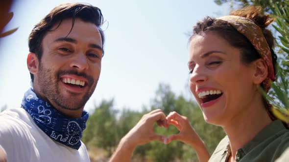 Romantic couple forming a heart shape 4k