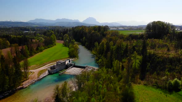 Drone Video of an River with Waterplant and Mountains