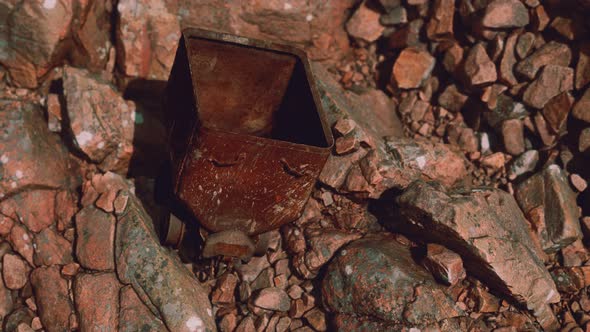 Abandoned Rusty Mine Cart on Rocks alt