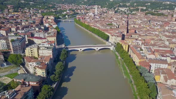 Verona, Italy: Aerial view of river and Bridges.Drone flies over the Adige river Aerial video in 4K.