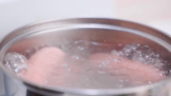 Appetizing Sausages are Boiled in Water Closeup