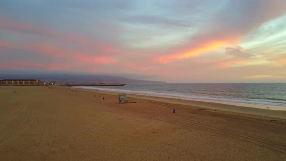 Aerial drone view of a sunset at the beach over the ocean