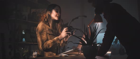 Man and woman have a discussion with camera in hand