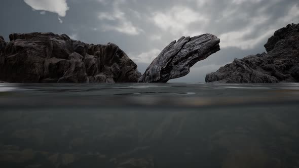 Half Underwater in Northern Sea with Rocks alt