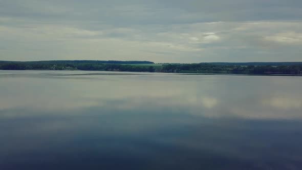 smooth surface of the river. Landscape of the river and forest with aerial view