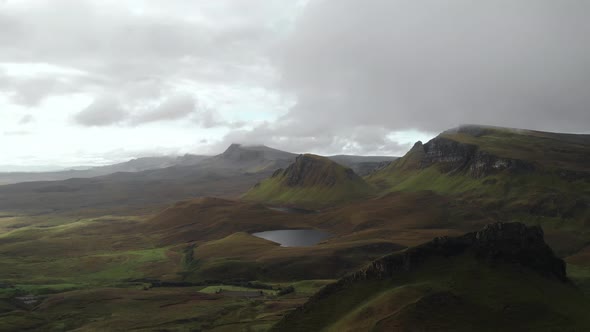 Drone view of quiraing green mountain landscape in isle of skye scotland. cloudy day