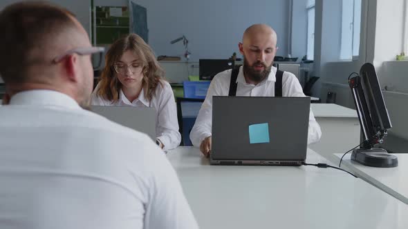 Close Up Coworkers Speak to Each Other