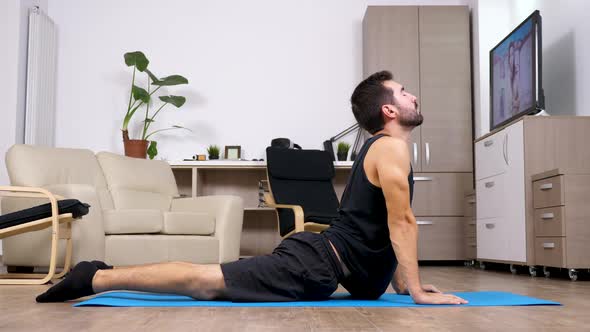 Young Fit Man Practicing Yoga and Doing Different Poses