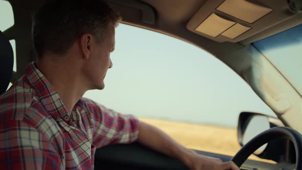 Man Driving Countryside Inside Vehicle Closeup