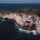 Aerial Shot of Waves Crashing on Small Tropical Rocky Island on the Coast  - VideoHive Item for Sale