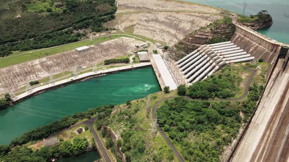 Cinematic drone footage - flying sideways over the river showing a hydroeletric at minas gerais in B