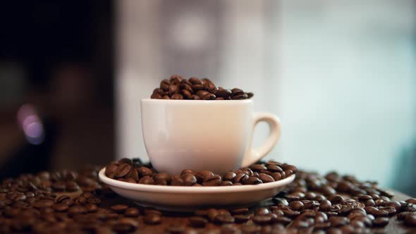 Slow Motion Coffee Beans In A Coffee Cup On A Turntable