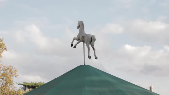 Horse figure atop carousel