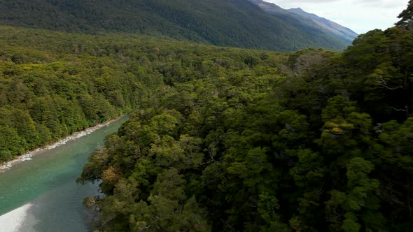 Aerial view of green river in a mountain valley. Fast flowing river in Blue Pools in New Zealand