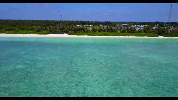 Aerial drone shot nature of tropical bay beach lifestyle by blue water with white sandy background o