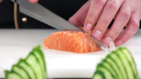 Chef Cutting Salmon Close Up