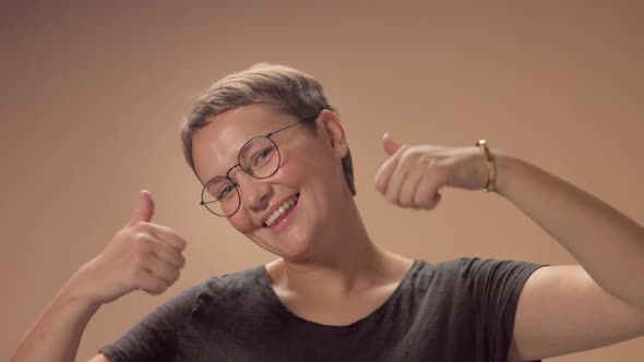 Caucasian Woman Smiling Wide and Lift Up Her Thumbs