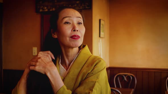 Elegant Japanese woman enjoying a coffee