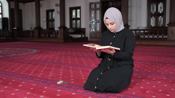 Girl Recite On Quran Book