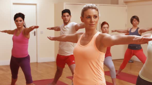 Group of people performing stretching exercising