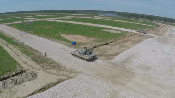Aerial shot of tanks firing targets during playwar