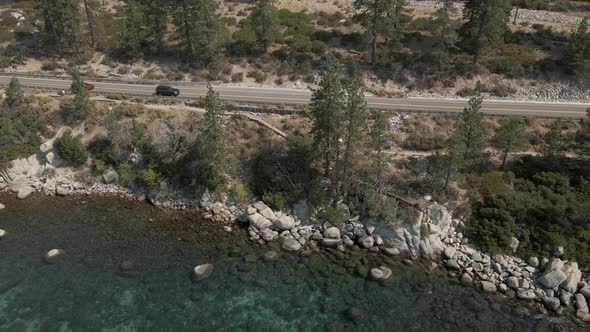 Mountain Road Along Crystal Clear Lake Cinematic Footage