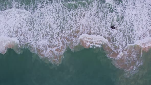 Beautiful texture of big waves power ocean waves with white waves break on beach sand at Phuket