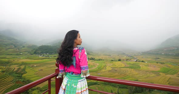 Asian Girl in Colorful Cultural Dress Standing on View Point of Rice Terraces.