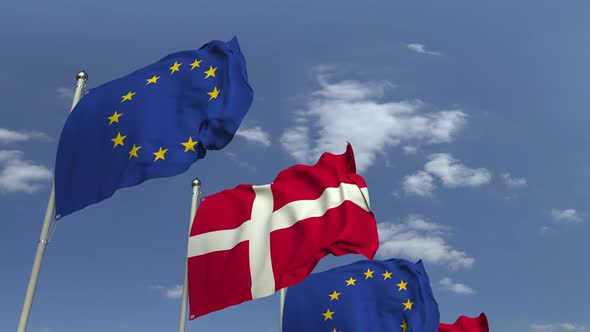 Waving Flags of Denmark and the EU on Sky Background alt