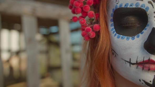 Half Face of Woman in Sugar Skull Makeup Open Eye